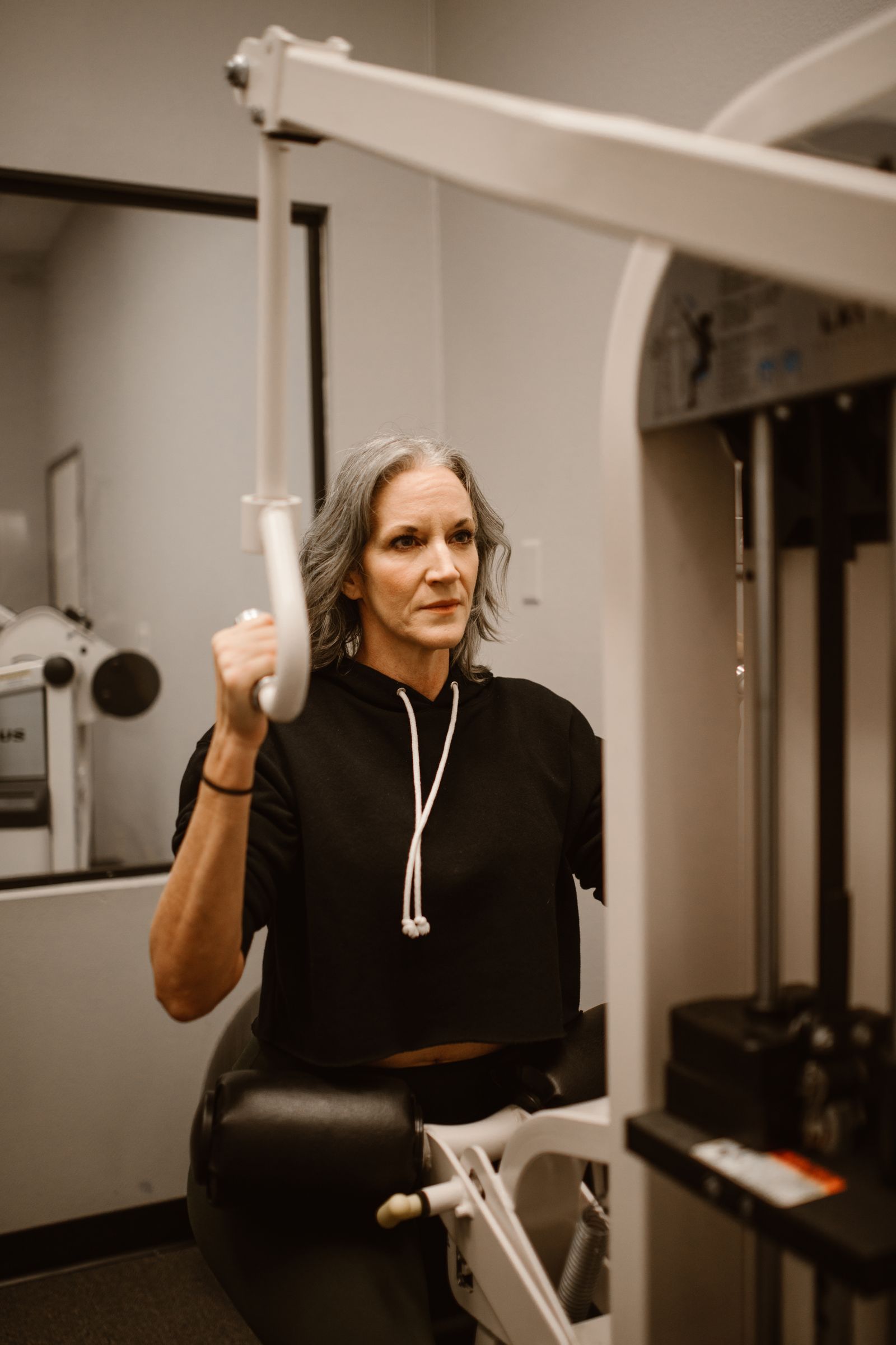 Woman using a resistance machine at the gym