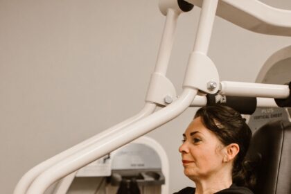 Woman working out on a resistance machine in a gym